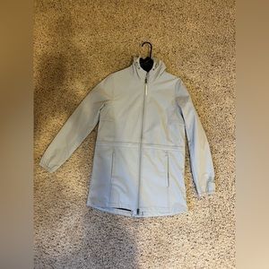 A grey New Balance rain/running coat size small. :)